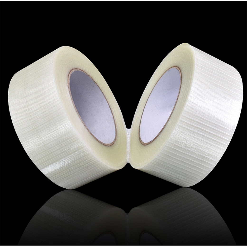 Cross weave tape used for carton reinforcement and pallet stabilization in industrial packaging